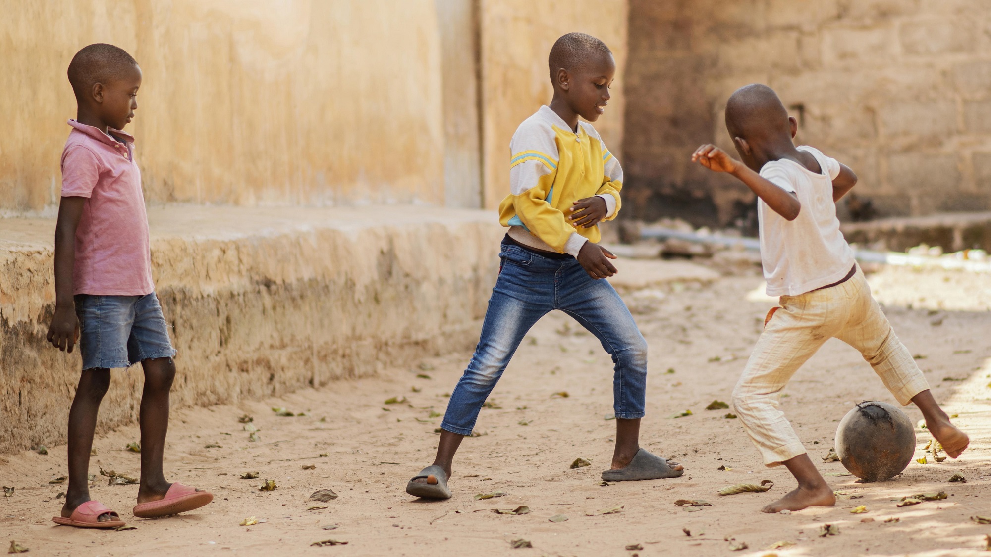 full-shot-african-kids-playing-with-ball